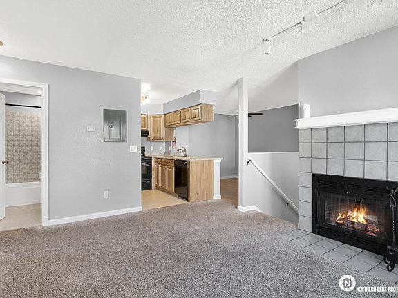 Bath, Kitchen, Dining/Work Area. The kitchen countertop is set up to function as an at-home workspace, featuring extra electrical plugins with USB chargers built-in.