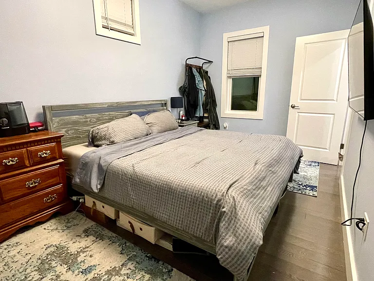 Master bedroom with king-sized bed (night time)