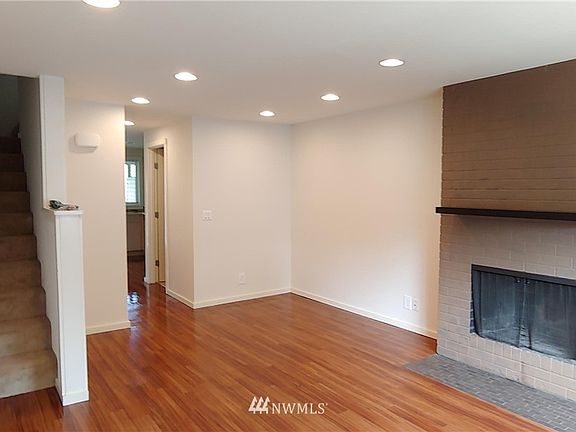 Main floor with entrance to the left. (Photos of 1106 taken prior to current tenants and before gas fireplace install.)