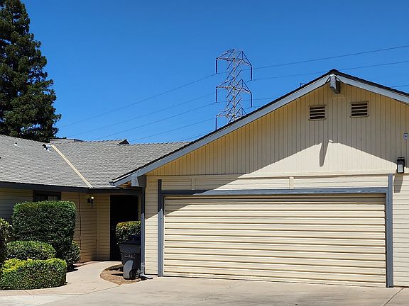 Unit 102 Front Entrance and 2-car Garage