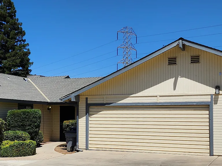 Unit 102 Front Entrance and 2-car Garage