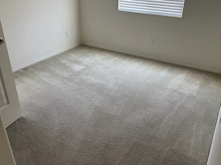 View of third upstairs bedroom with ceiling fan/light and large walk-in closet.