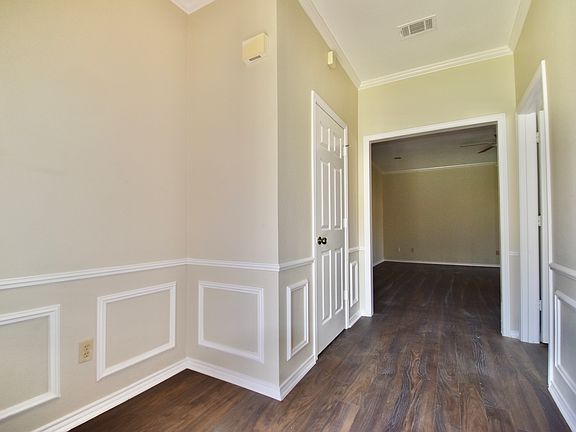 Entrance with new flooring and fresh paint in 2024.