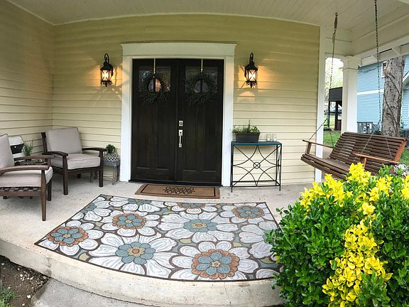 This cosy front porch is the best place for morning coffee.