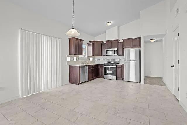 Double glass doors lead from the dining area/living room to the exterior. Large double glass doors let the sunlight in
