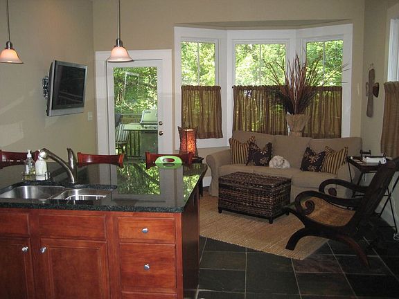 Updated Kitchen w/ Granite and Stainless, boasting a private sitting area.