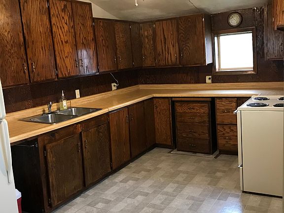 Kitchen showing electric stove on the right.