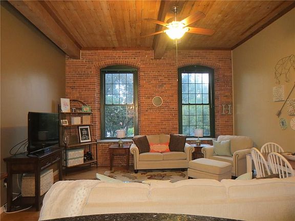 Ceiling fan, wood ceiling, large windows let's light stream in!
