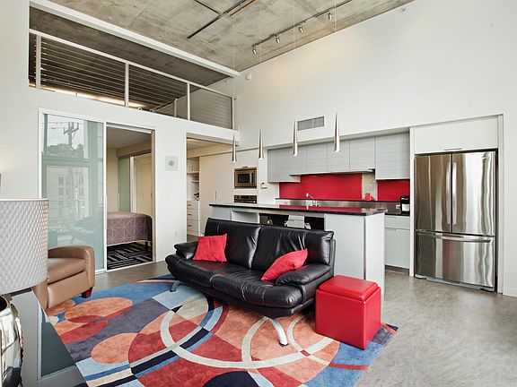 Living space looking towards Bedroom, Loft, and corridor.