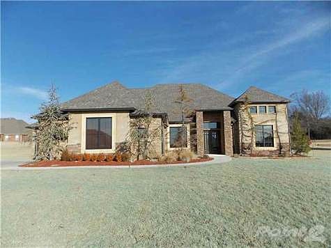 Front of house with side car entry.