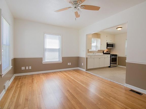 Highlighted by natural light the beautiful wood floors cover the open Family Room leading into the ceramic tiled Kitchen.