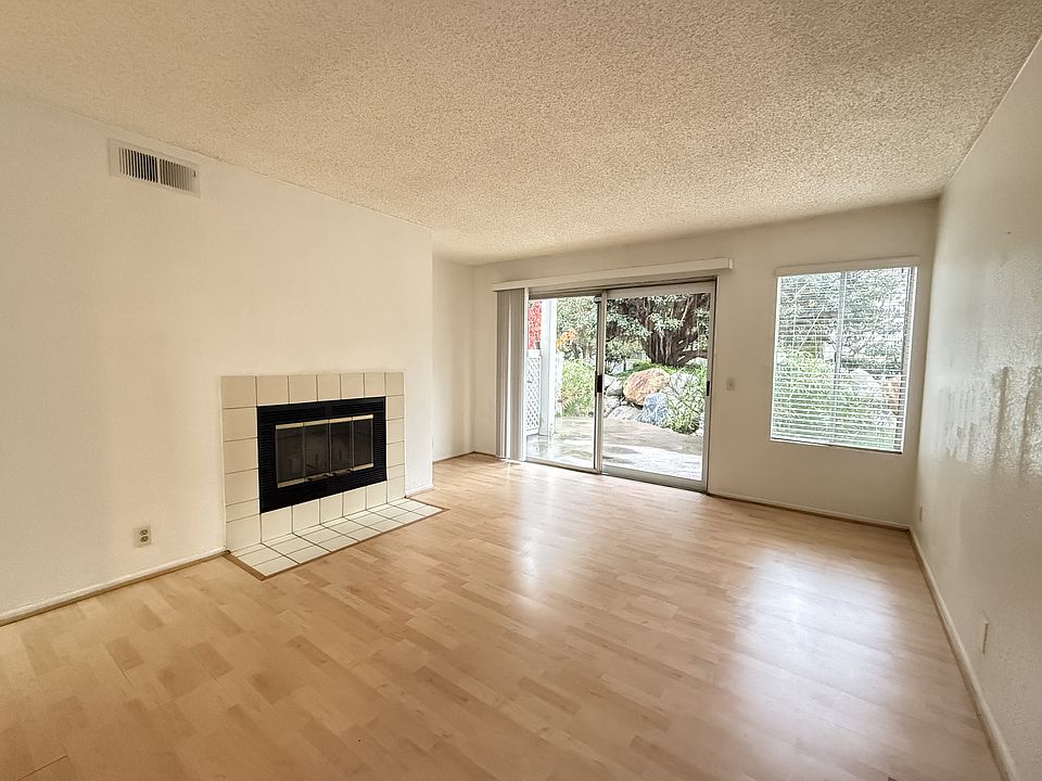 Fireplace in living room. Extended to your own backyard with pond and waterfall.