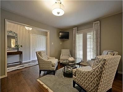 Formal living includes mounted small tv