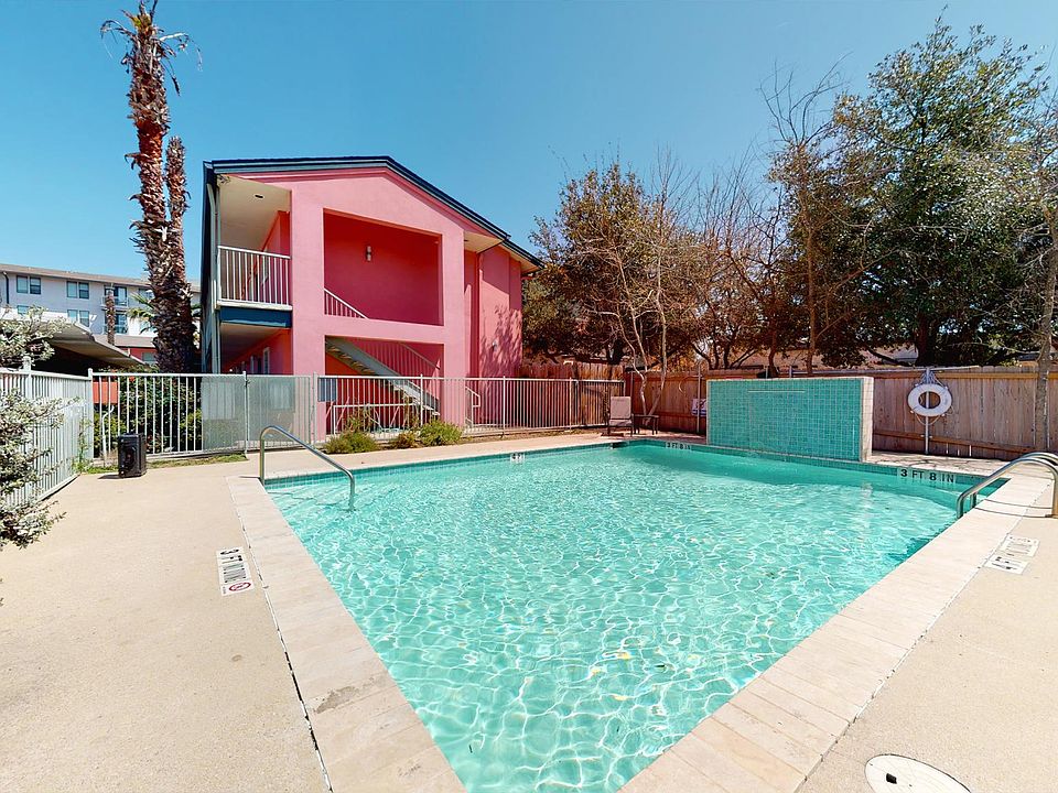 Great pool area with water feature and tropical feel - lots of palm trees on property
