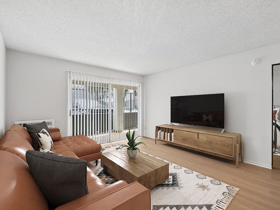 Renovated Package I living room with updated hard surface flooring (select homes)