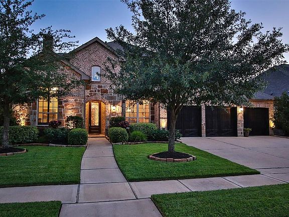 This home is just as warm and inviting in the dusk hours as it is during the day!