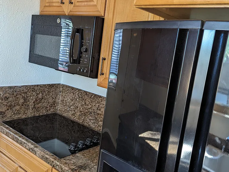 Microwave and Countertop stove.