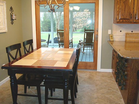 Kitchen overlooking screened porch/rear yard.