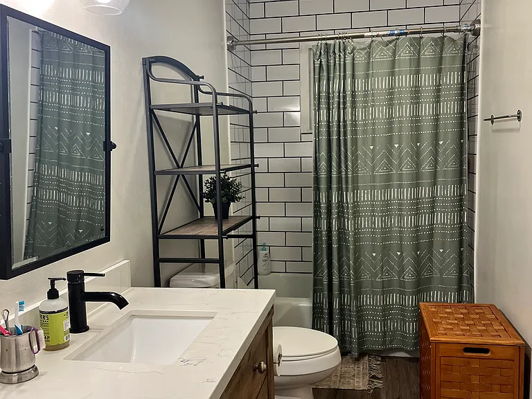 Full bathroom in hallway, perfect for guests
