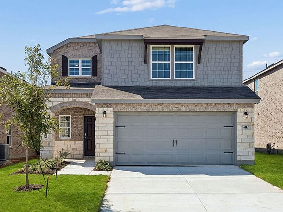 The Coolidge, a 2-story new construction home with a two car garage