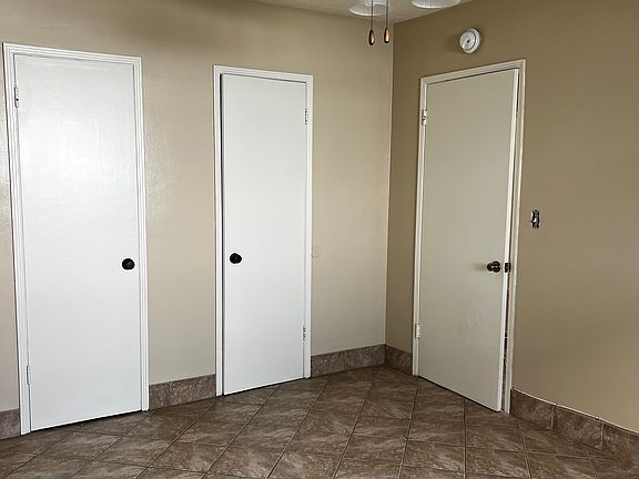 Bedroom from reverse angle, two connecting closets