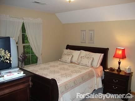 Upstairs bedroom on left : Partial view of one of the two upstairs bedrooms