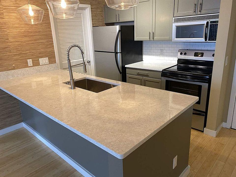 Kitchen with s/s appliances including dishwasher, new quartz countertop, new sink, new garbage disposal, new back splash,