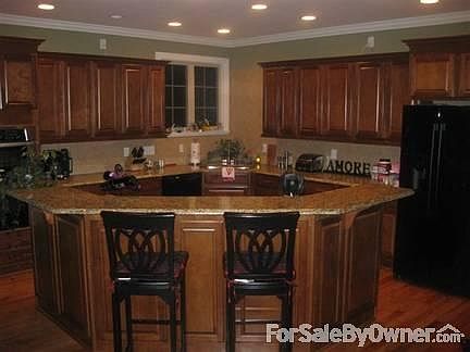 Grand kitchen with split cooking!
						:
						Granite countertops, tons of finished cabinets, and soft-close drawers.