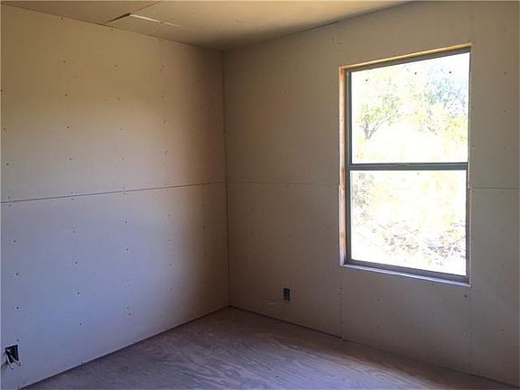 Bedroom 1 with drywall.