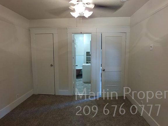 Bedroom has ceiling fan.