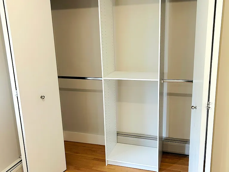A second closet, showcasing the built-in shelving.