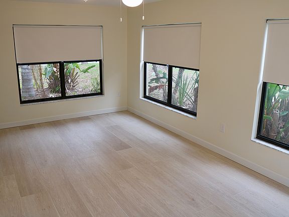 Custom blinds throughout the house. Blackout quality. Easy maintenance tile floors. Ceiling fans and well lit.