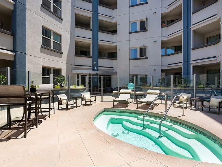 Spa and grill area with cabana and outdoor seating