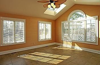 Solairium has 18' tile floors, grass cloth walls and overlooks 18th fairway