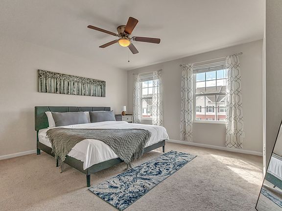Master Bedroom with room darkening shades, King Bed and Ceiling fan