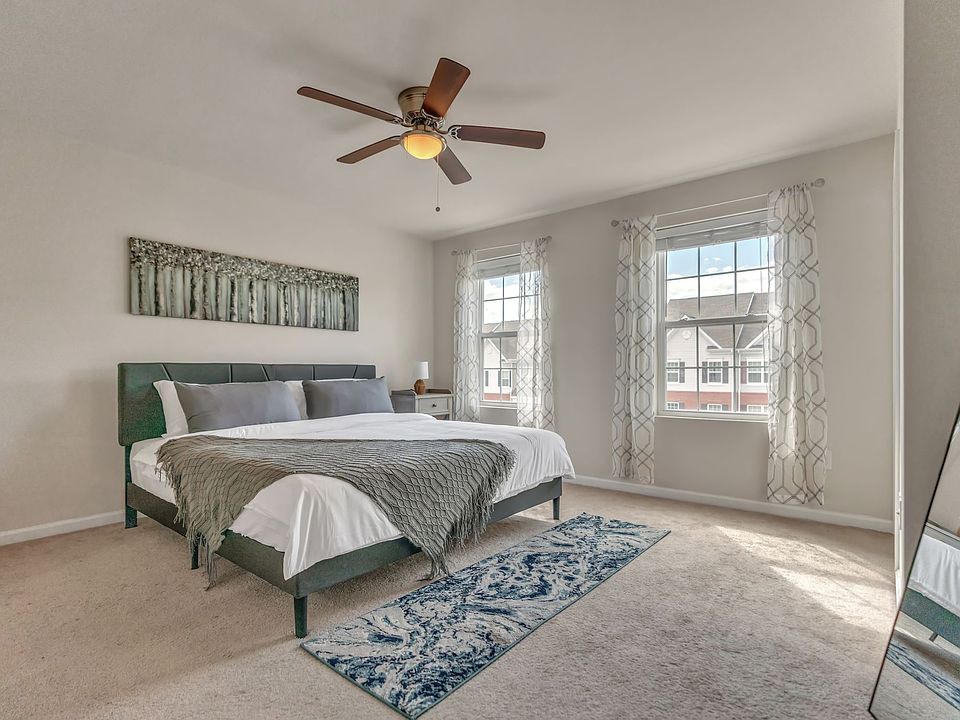 Master Bedroom with room darkening shades, King Bed and Ceiling fan