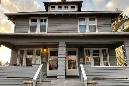 Historic neighborhood that is family-oriented. Each side of the duplex has its own covered porch.