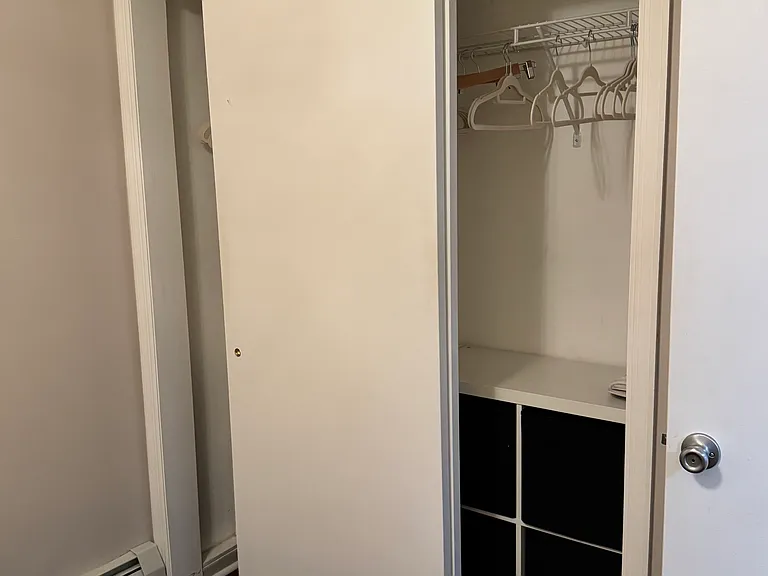 Bedroom closet with storage.