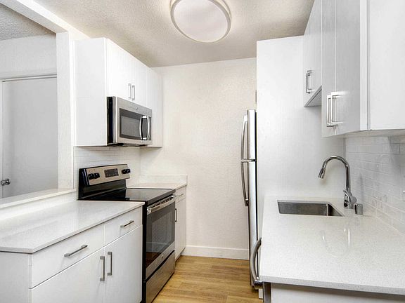 Kitchen with Stainless Steel Appliances and Quartz Countertops