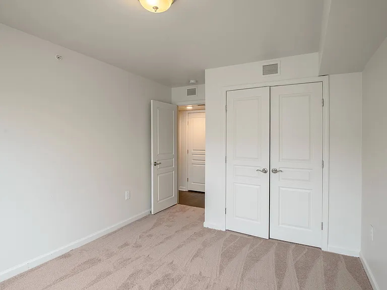 Spacious bedrooms with plush carpeting and large closets create a cozy and private retreat for relaxation.