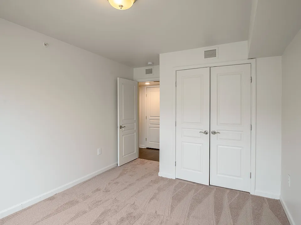 Spacious bedrooms with plush carpeting and large closets create a cozy and private retreat for relaxation.