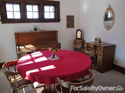Dining Room left off front Entry Way
						:
						Triple Windows to left of table - kitchen entrance to left