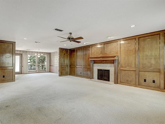 This overlarge living room with its wood burning fireplace will hold all your friends and relatives for holidays or any get toge