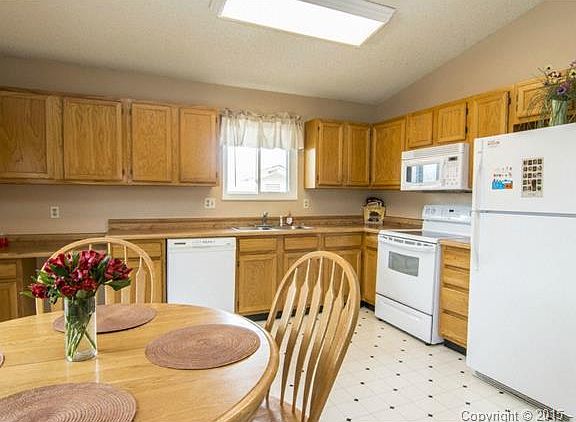 Spacious eat- in kitchen with plenty of counter and cabinet spac