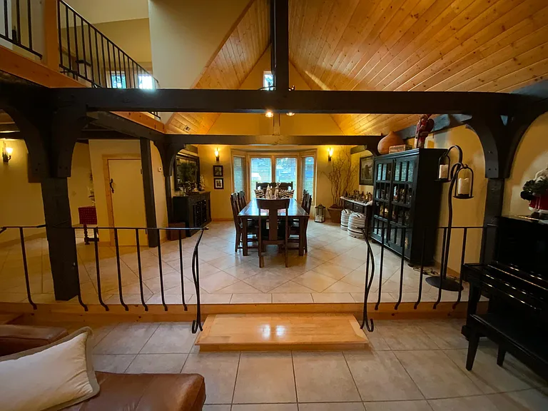 Upper area to the L of entrance looking into a formal dining area from the living room. This area has also been used for a pool table, library, TV space so it is versatile for your needs.