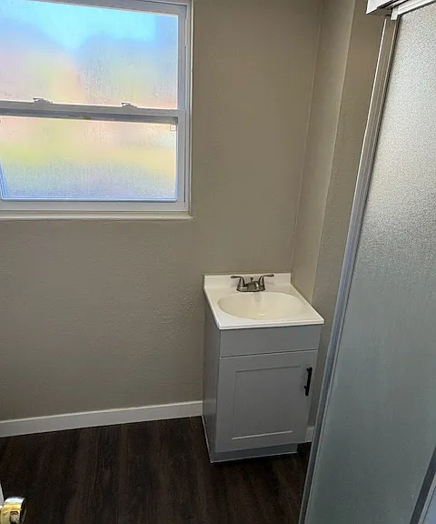 Lower level bathroom has shower sink and toilet.