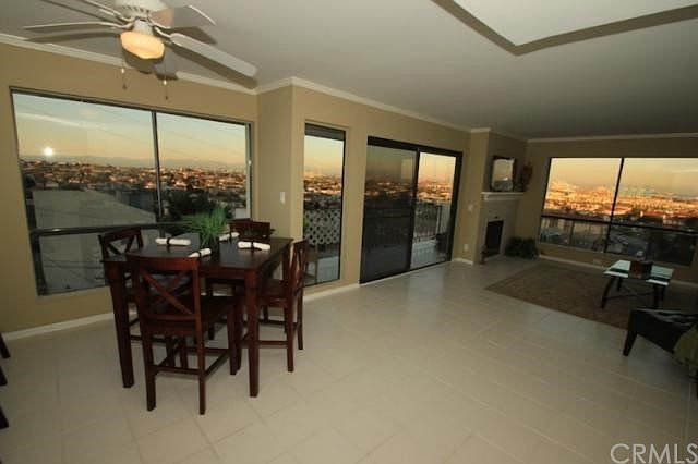 Living and dining room with amazing views surrounding.  Entire unit is freshly painted in 2 tone paint