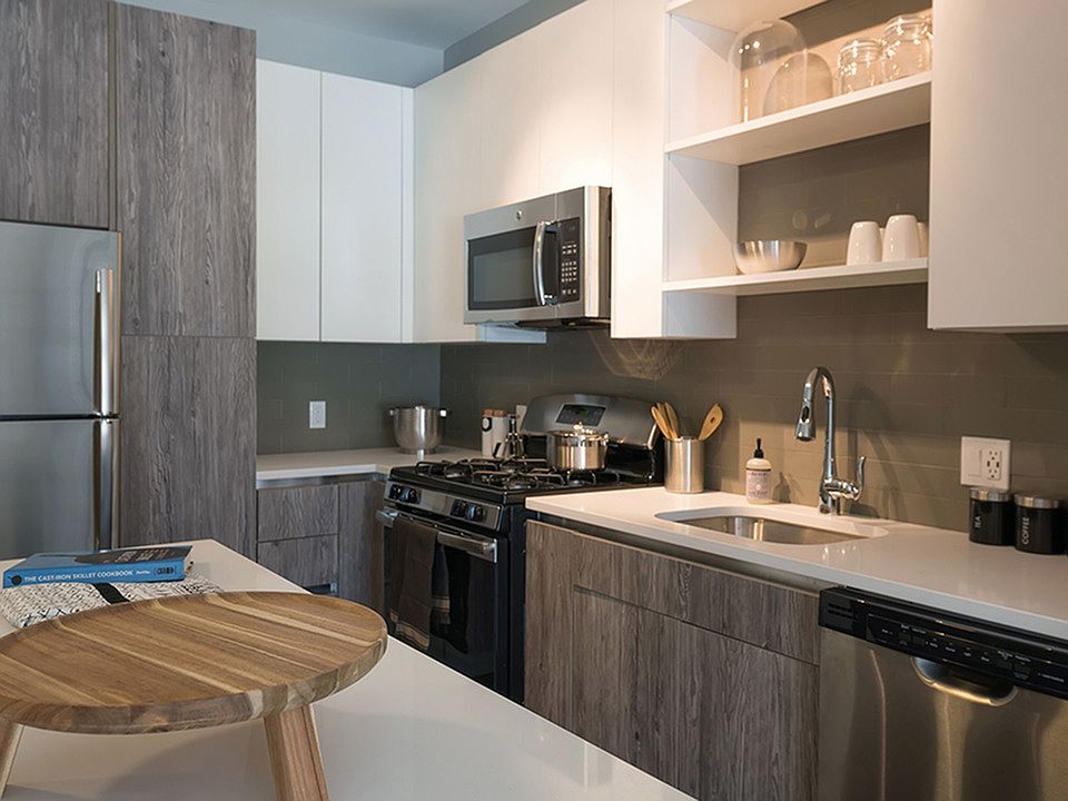 Two tone cabinetry with ample storage options including pantry