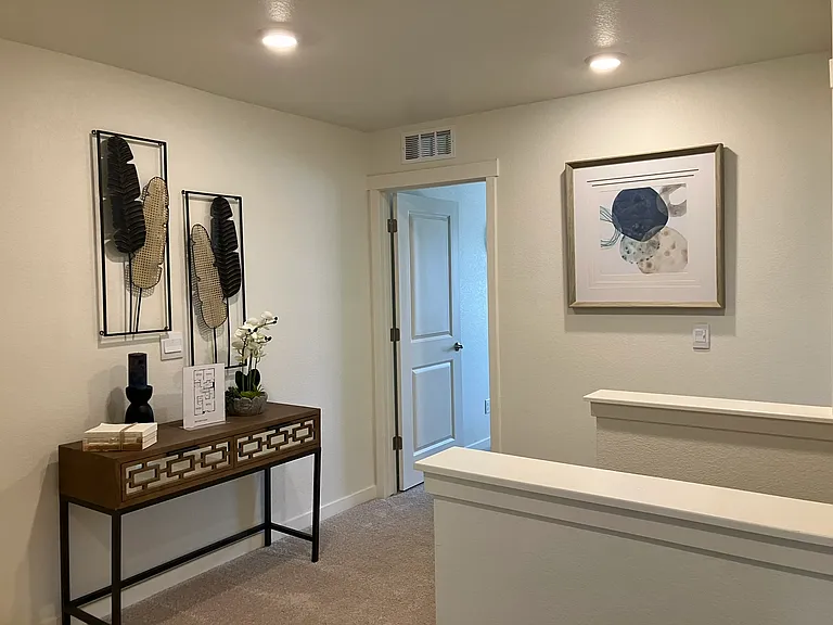 Sample of same floor plan, different finishes, staged with furniture.