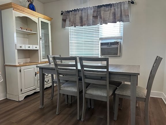 Custom blinds throughout. The blinds over the air conditioner have two tracts so that the A/C can have the blind over it, or not over it.